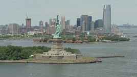 4.8K aerial stock footage zooming in on Statue of Liberty overlooking New York Harbor, New York Aerial Stock Footage | AX83_198E