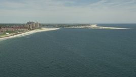 4.8K aerial stock footage approaching beach, apartment complexes, and East Rockaway Inlet in Atlantic Beach, Long Island, New York Aerial Stock Footage | AX83_232