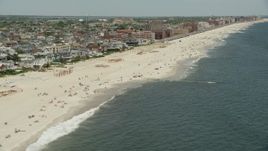 4.8K aerial stock footage flying by beachfront condominiums, Long Beach, New York Aerial Stock Footage | AX83_238E