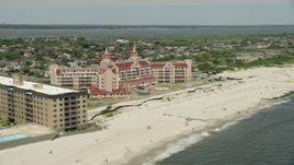 4.8K aerial stock footage flying by a Beachside Condominium Complex, Lido Beach, New York Aerial Stock Footage | AX83_243