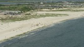 4.8K aerial stock footage of a group of people on a Sandy Beach, Lido Beach, New York Aerial Stock Footage | AX83_245