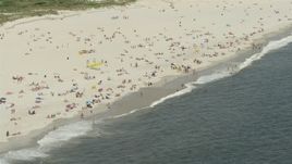 4.8K aerial stock footage of a group of people on a Sandy Beach, Lido Beach, New York Aerial Stock Footage | AX83_246E