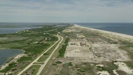 4.8K aerial stock footage flying over beach and coastal roads in Jones Beach State Park, Wantagh, New York Aerial Stock Footage | AX83_249E