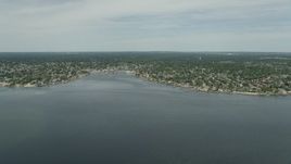 4.8K aerial stock footage approaching Massapequa from small marshy islands in South Oyster Bay in New York Aerial Stock Footage | AX83_257E
