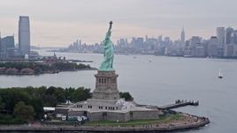 4K aerial stock footage of flying by the Statue of Liberty, New York, New York Aerial Stock Footage | AX84_003E