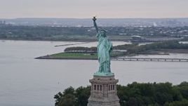 4K aerial stock footage Flying by the Statue of Liberty, New York, New York Aerial Stock Footage | AX84_006