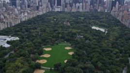 4K aerial stock footage Flying over Central Park, revealing Midtown Manhattan, New York, New York Aerial Stock Footage | AX84_043