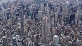 4K aerial stock footage of approaching the iconic Empire State Building, Midtown Manhattan, New York City Aerial Stock Footage | AX84_059E