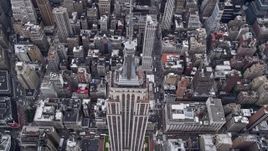 4K aerial stock footage approach and tilt to bird's eye view of Empire State Building, Midtown Manhattan, New York City Aerial Stock Footage | AX84_062E