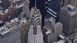 4K aerial stock footage approach and tilt to bird's eye view of top of Chrysler Building, Midtown Manhattan, New York City Aerial Stock Footage | AX84_072E