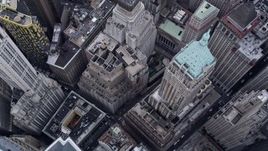 4K aerial stock footage of approaching 40 Wall Street, tilt to bird's eye view in Lower Manhattan, New York City Aerial Stock Footage | AX84_086E