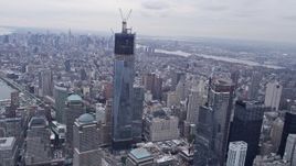 4K aerial stock footage tilt from Lower Manhattan, reveal One World Trade Center, New York, New York Aerial Stock Footage | AX84_089E