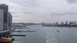 4K aerial stock footage Approaching barge on Hudson River, Brooklyn Bridge, New York, New York Aerial Stock Footage | AX84_114