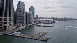 4K aerial stock footage Flying by Downtown Manhattan Heliport, tilt down, New York, New York Aerial Stock Footage | AX84_115