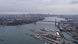 4K aerial stock footage of the Williamsburg Bridge and Midtown Manhattan skyline, New York City Aerial Stock Footage | AX84_121E