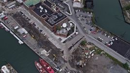 4K aerial stock footage Flying over Brooklyn Navy Yard piers, reveal Williamsburg Bridge, New York, New York Aerial Stock Footage | AX84_123