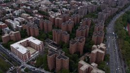 4K aerial Video fly over public housing on the Lower East Side housing, tilt to reveal Midtown skyline, New York City Aerial Stock Footage | AX84_127E