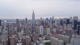 4K Aerial Video Fly by Empire State Building, Midtown Manhattan skyscrapers, New York, New York Aerial Stock Footage | AX84_135