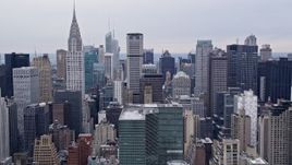 4K aerial stock footage of flying by Midtown Manhattan skyscrapers and the Chrysler Building, New York City Aerial Stock Footage | AX84_145E