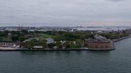 4K Aerial Video Flying by Castle Williams, Governors Island, New York Harbor, New York, New York Aerial Stock Footage | AX84_161