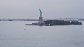 4K Aerial Video Tilting up to Statue of Liberty from New York Harbor, New York, New York Aerial Stock Footage | AX84_162