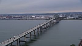 4K Aerial Video Flying by Newark Bay Bridge, reveal Lehigh Valley Railroad Bridge, Newark, New Jersey Aerial Stock Footage | AX84_172