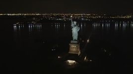 4K aerial stock footage Orbiting the Statue of Liberty, New York, New York, night Aerial Stock Footage | AX85_005