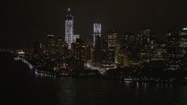 4K aerial stock footage Tilt up to reveal World Trade Center, Lower Manhattan, New York, New York, night Aerial Stock Footage | AX85_012