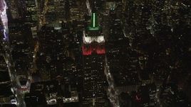 4K aerial stock footage Tilt down on Empire State Building, Midtown Manhattan, New York, New York, night Aerial Stock Footage | AX85_037