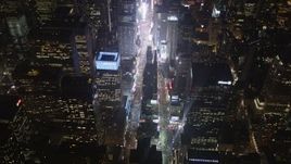 4K aerial stock footage Tilting up to reveal Times Square, Midtown Manhattan, New York, New York, night Aerial Stock Footage | AX85_043