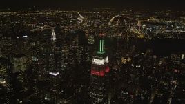4K aerial stock footage Flying by Empire State Building, Midtown Manhattan, New York, New York, night Aerial Stock Footage | AX85_047