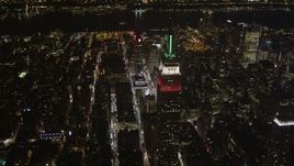 4K aerial stock footage Flying by the Empire State Building, Midtown Manhattan, New York, New York, night Aerial Stock Footage | AX85_051