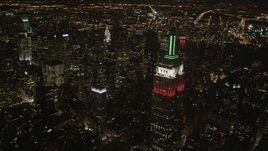 4K aerial stock footage Flying by Empire State Building, Midtown Manhattan; New York, New York, night Aerial Stock Footage | AX85_056