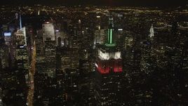 4K aerial stock footage Flying by Empire State Building, revealing Times Square, New York, New York, night Aerial Stock Footage | AX85_057