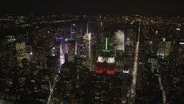 4K aerial stock footage Flying by Empire State Building, Midtown Manhattan, New York, New York, night Aerial Stock Footage | AX85_058
