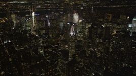4K aerial stock footage Tilt up revealing Chrysler Building, Midtown Manhattan, New York, New York, night Aerial Stock Footage | AX85_061