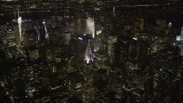 4K aerial stock footage Approaching Chrysler Building, Midtown Manhattan, New York, New York, night Aerial Stock Footage | AX85_062