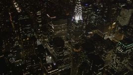 4K aerial stock footage Tilt up to reveal Chrysler Building, Midtown Manhattan, New York, New York, night Aerial Stock Footage | AX85_067