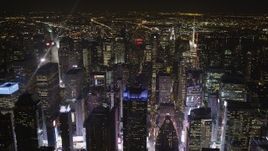 4K aerial stock footage Times Square skyscrapers, Midtown Manhattan, New York, New York, night Aerial Stock Footage | AX85_075