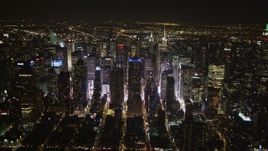 4K aerial stock footage Skyscrapers in Midtown Manhattan, streets, New York, New York, night Aerial Stock Footage | AX85_093