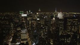 4K aerial stock footage Flying by Midtown Manhattan skyscrapers, New York, New York, night Aerial Stock Footage | AX85_104