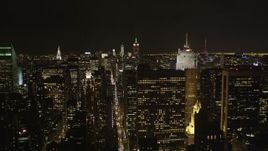 4K aerial stock footage Flying by Midtown Manhattan skyscrapers, New York, New York, night Aerial Stock Footage | AX85_105