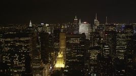 4K aerial stock footage Flying by skyscrapers in Midtown Manhattan, New York, New York, night Aerial Stock Footage | AX85_106
