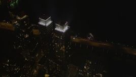 4K aerial stock footage Approach skyscrapers, Hudson River, Midtown Manhattan, New York, night Aerial Stock Footage | AX85_108