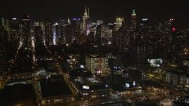 4K aerial stock footage Midtown Manhattan skyscrapers, from Hudson River, New York, New York, night Aerial Stock Footage | AX85_111