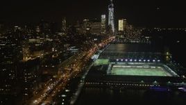4K aerial stock footage Tilt up from piers, Chelsea, Lower Manhattan, New York, New York, night Aerial Stock Footage | AX85_117