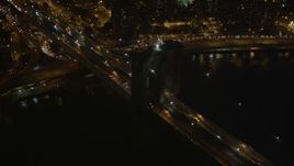 4K aerial stock footage Flying by the Brooklyn Bridge, New York, New York, night Aerial Stock Footage | AX85_128