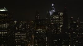 4K aerial stock footage Flying by Lower Manhattan skyscrapers, New York, New York, night Aerial Stock Footage | AX85_131