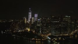 4K aerial stock footage Flying away from Lower Manhattan, New York, New York, night Aerial Stock Footage | AX85_133