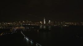 4K aerial stock footage Flying away from Lower Manhattan skyline, New York, New York, night Aerial Stock Footage | AX85_136